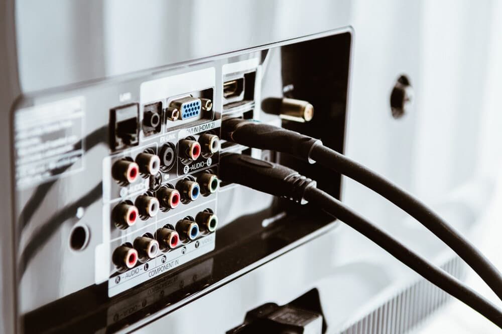 A Close Up Of The Back Of A Television With Cables Plugged Into It — Coastwide Antennas In Killcare, NSW